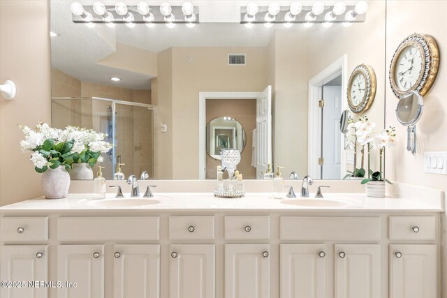 425 N Ocean Grande Dr Unit 205, Ponte Vedra Beach, FL 32082 - bathroom featuring a stall shower and double vanity