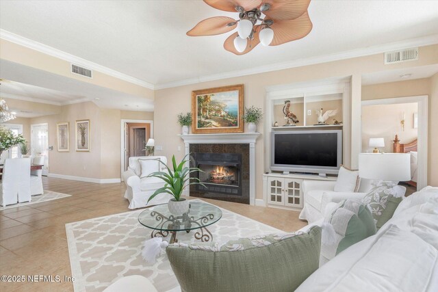 425 N Ocean Grande Dr Unit 205, Ponte Vedra Beach, FL 32082 - tiled living room featuring a fireplace, ornamental molding, baseboards, and ceiling fan