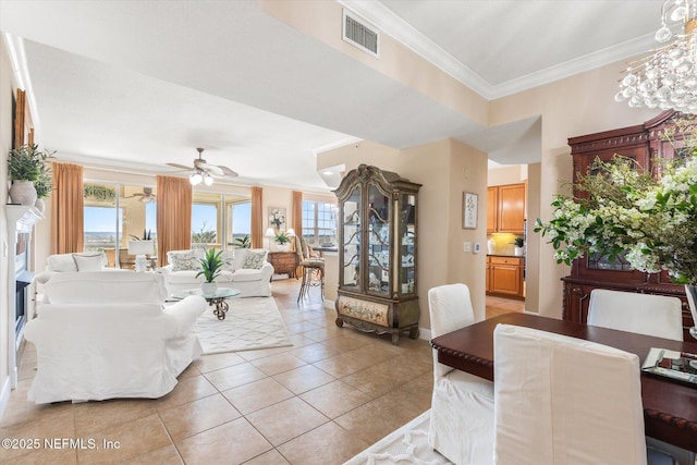 425 N Ocean Grande Dr Unit 205, Ponte Vedra Beach, FL 32082 - living room featuring ornamental molding, light tile patterned floors, ceiling fan, and baseboards