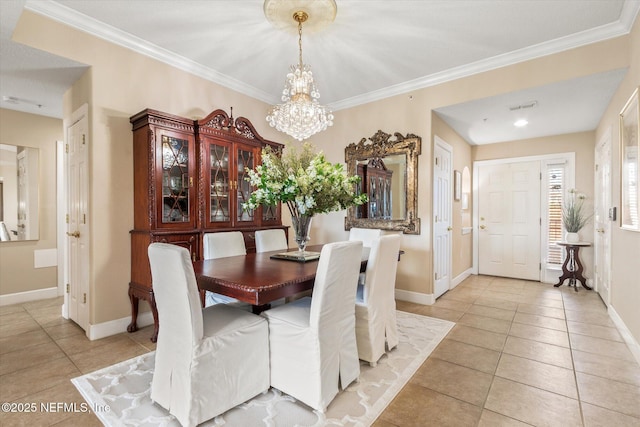 425 N Ocean Grande Dr Unit 205, Ponte Vedra Beach, FL 32082 - dining area with light tile patterned flooring, a chandelier, baseboards, and ornamental molding