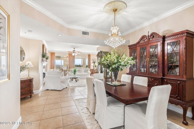 425 N Ocean Grande Dr Unit 205, Ponte Vedra Beach, FL 32082 - dining area featuring light tile patterned flooring, crown molding, a chandelier, baseboards, and ceiling fan