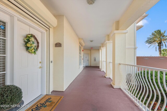 425 N Ocean Grande Dr Unit 205, Ponte Vedra Beach, FL 32082 - entrance to property with a balcony and stucco siding