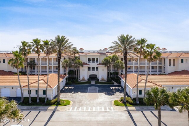425 N Ocean Grande Dr Unit 205, Ponte Vedra Beach, FL 32082 - view of building exterior with a residential view and driveway