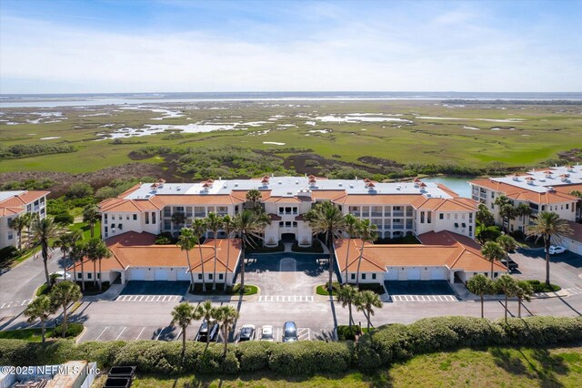 425 N Ocean Grande Dr Unit 205, Ponte Vedra Beach, FL 32082 - drone / aerial view of a nearby body of water and apartment complex / building