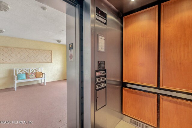 425 N Ocean Grande Dr Unit 205, Ponte Vedra Beach, FL 32082 - elevator with carpet floors and a smoke detector