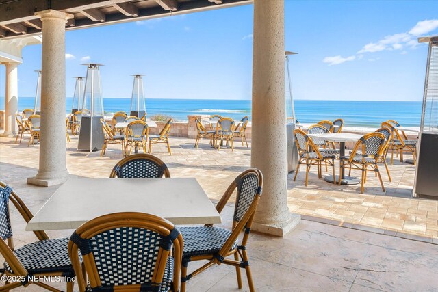 425 N Ocean Grande Dr Unit 205, Ponte Vedra Beach, FL 32082 - view of patio with outdoor dining space and a water view