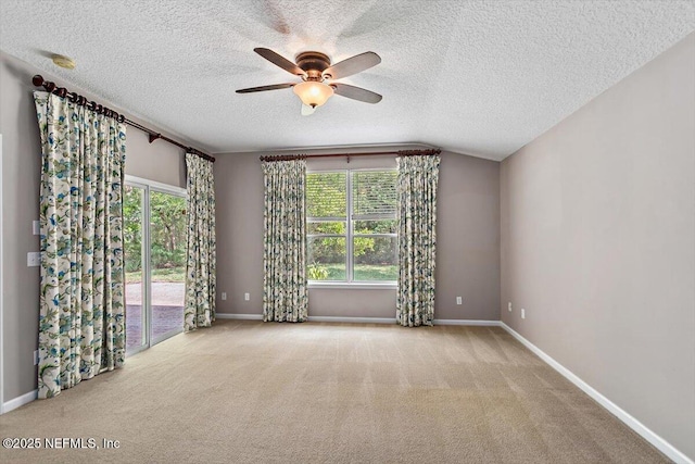 663 Reflection Cove Ct, Jacksonville, FL 32218 - carpeted spare room with ceiling fan, a textured ceiling, baseboards, and vaulted ceiling