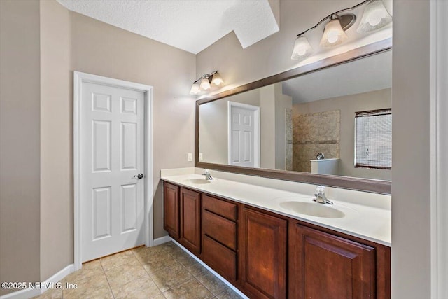 663 Reflection Cove Ct, Jacksonville, FL 32218 - full bath featuring double vanity, tile patterned flooring, tiled shower, and baseboards