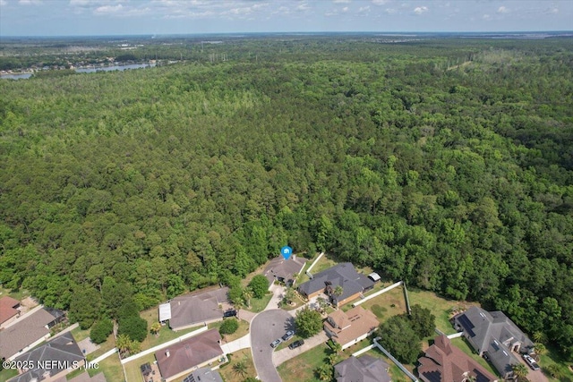 663 Reflection Cove Ct, Jacksonville, FL 32218 - aerial view of property's location featuring a heavily wooded area and nearby suburban area