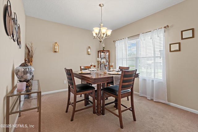 4008 Cormorant Ln, Middleburg, FL 32068 - dining area featuring a chandelier, light colored carpet, and baseboards