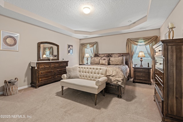 4008 Cormorant Ln, Middleburg, FL 32068 - bedroom featuring a textured ceiling, light colored carpet, baseboards, and a raised ceiling