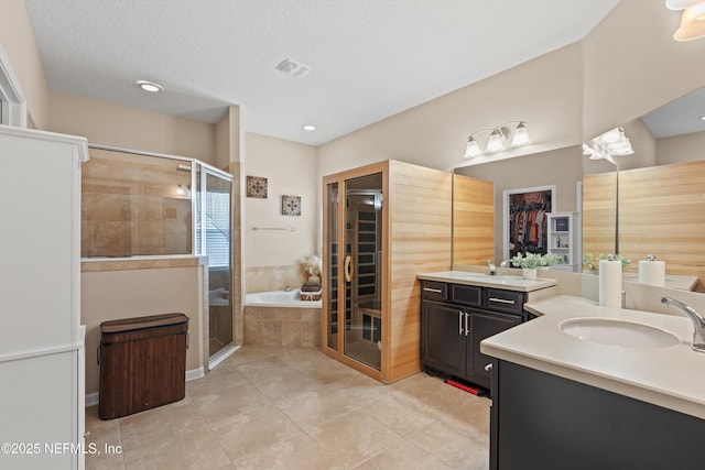 4008 Cormorant Ln, Middleburg, FL 32068 - full bath with a shower stall, a bath, tile patterned flooring, and two vanities