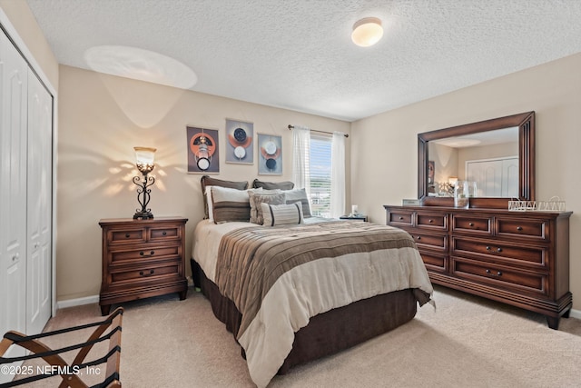 4008 Cormorant Ln, Middleburg, FL 32068 - bedroom featuring light colored carpet, a textured ceiling, a closet, and baseboards
