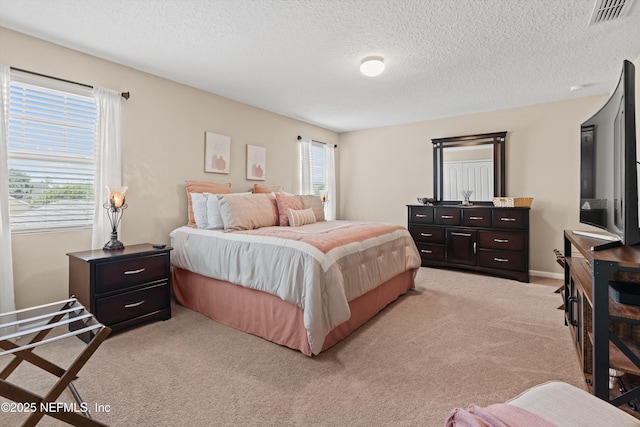 4008 Cormorant Ln, Middleburg, FL 32068 - bedroom with light colored carpet, a textured ceiling, and baseboards