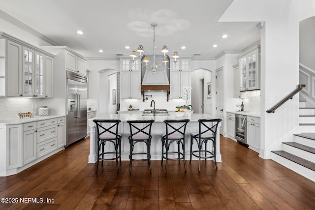14103 Magnolia Cove Rd, Jacksonville, FL 32224 - kitchen featuring stainless steel built in fridge, arched walkways, wine cooler, backsplash, and a chandelier