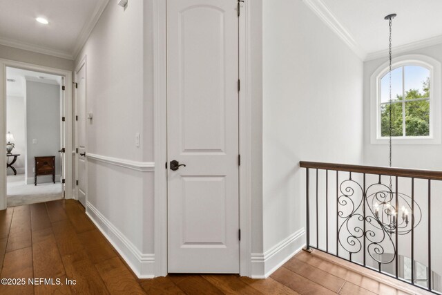 14103 Magnolia Cove Rd, Jacksonville, FL 32224 - hallway featuring a chandelier, crown molding, hardwood / wood-style floors, and baseboards