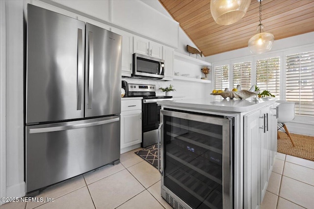188 Sea Hammock Way Unit 188, Ponte Vedra Beach, FL 32082 - kitchen featuring appliances with stainless steel finishes, beverage cooler, wood ceiling, light tile patterned flooring, and lofted ceiling