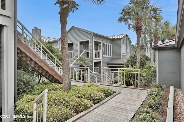 188 Sea Hammock Way Unit 188, Ponte Vedra Beach, FL 32082 - rear view of property featuring stairway, a standing seam roof, metal roof, and a balcony