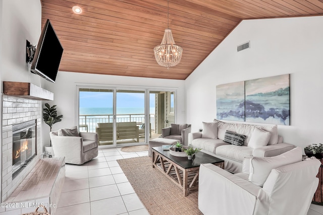 188 Sea Hammock Way Unit 188, Ponte Vedra Beach, FL 32082 - living area with wood ceiling, light tile patterned floors, a chandelier, a fireplace, and high vaulted ceiling