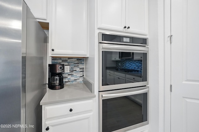 1459 Stillwater Blvd, Saint Johns, FL 32259 - kitchen featuring appliances with stainless steel finishes, tasteful backsplash, white cabinetry, and light countertops