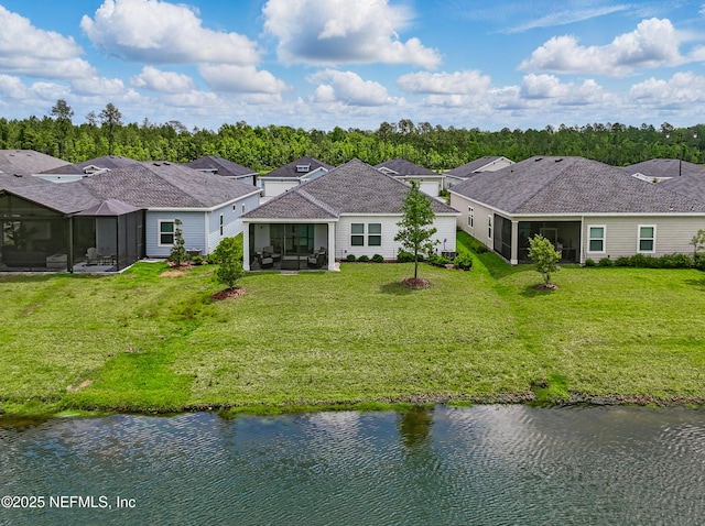 1459 Stillwater Blvd, Saint Johns, FL 32259 - rear view of house featuring a sunroom, a lawn, and a water view