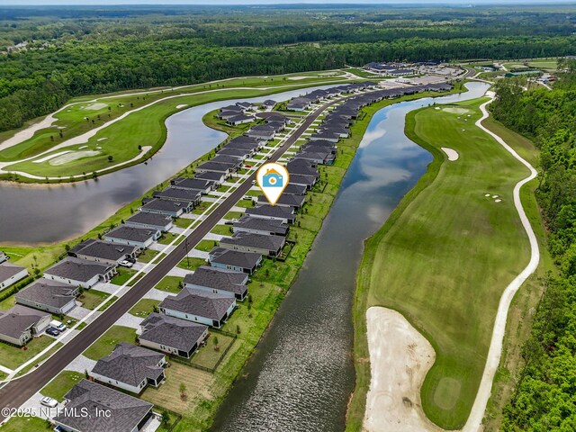 1459 Stillwater Blvd, Saint Johns, FL 32259 - aerial perspective of suburban area featuring a forest, a local golf course, and a large body of water