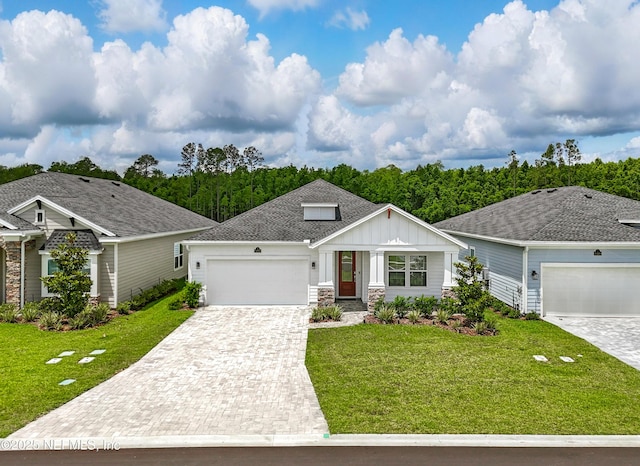 1459 Stillwater Blvd, Saint Johns, FL 32259 - view of front of home with an attached garage, board and batten siding, a front yard, and decorative driveway