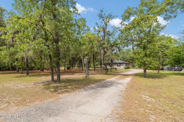 2658 Apache Ct, Middleburg, FL 32068 - view of dirt / gravel road featuring view of scattered trees