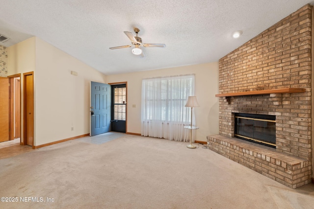 2658 Apache Ct, Middleburg, FL 32068 - unfurnished living room with a ceiling fan, vaulted ceiling, carpet flooring, a fireplace, and a textured ceiling
