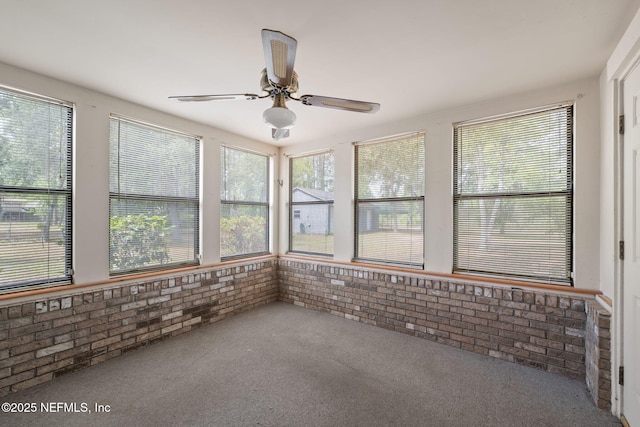 2658 Apache Ct, Middleburg, FL 32068 - unfurnished sunroom featuring brick wall and carpet