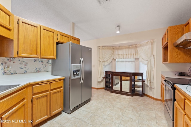 2658 Apache Ct, Middleburg, FL 32068 - kitchen featuring stainless steel appliances, under cabinet range hood, light countertops, baseboards, and a textured ceiling