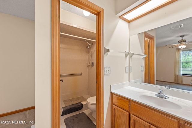 2658 Apache Ct, Middleburg, FL 32068 - bathroom with toilet, a shower stall, vanity, and a ceiling fan