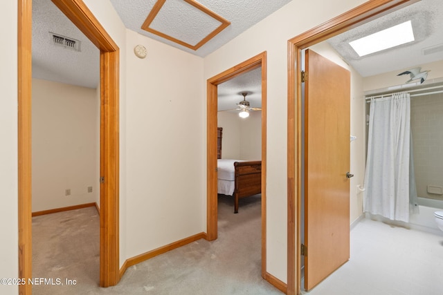 2658 Apache Ct, Middleburg, FL 32068 - hall featuring a textured ceiling, carpet, and baseboards