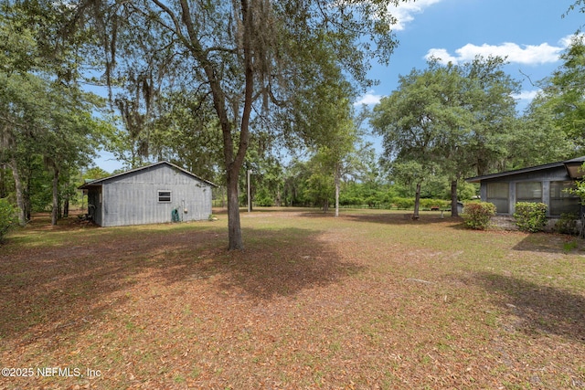 2658 Apache Ct, Middleburg, FL 32068 - view of grassy yard with an outbuilding and an outdoor structure