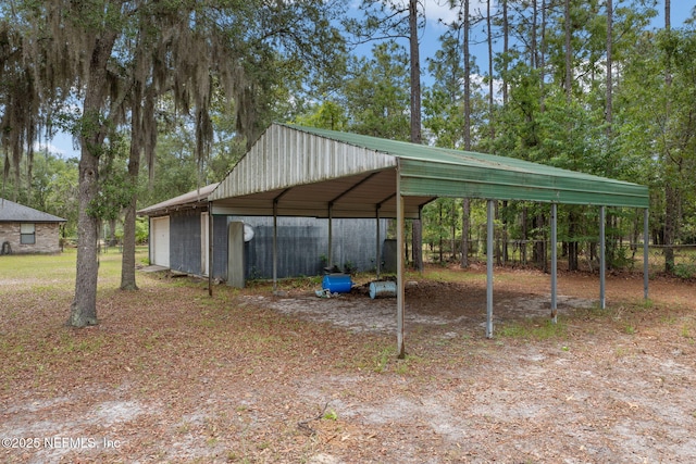 2658 Apache Ct, Middleburg, FL 32068 - view of parking / parking lot with a garage and view of scattered trees