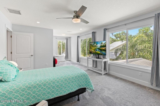 8211 Colee Cove Branch Rd Unit G, Saint Augustine, FL 32092 - carpeted bedroom featuring baseboards, a textured ceiling, ceiling fan, and recessed lighting