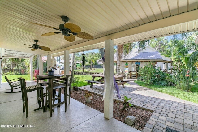 8211 Colee Cove Branch Rd Unit G, Saint Augustine, FL 32092 - view of patio / terrace featuring outdoor dining area and ceiling fan
