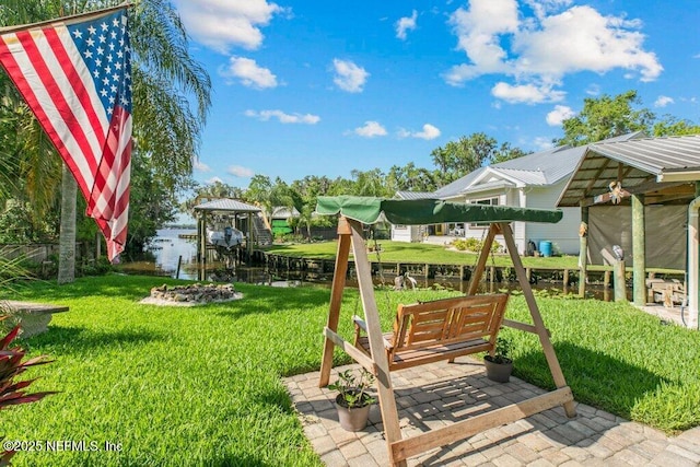 8211 Colee Cove Branch Rd Unit G, Saint Augustine, FL 32092 - view of grassy yard featuring a water view and a patio area