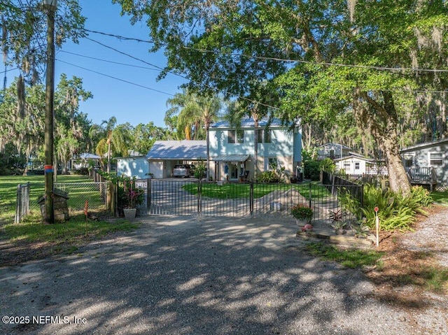 8211 Colee Cove Branch Rd Unit G, Saint Augustine, FL 32092 - view of front of home with a gate, a fenced front yard, a carport, and metal roof