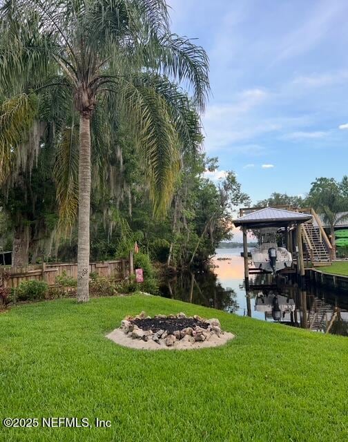 8211 Colee Cove Branch Rd Unit G, Saint Augustine, FL 32092 - dock area with boat lift, a water view, and an outdoor fire pit