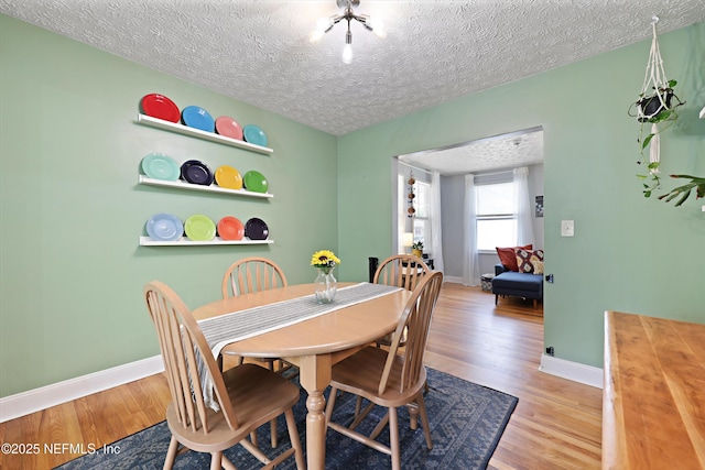 5327 Attleboro St, Jacksonville, FL 32205 - dining space featuring wood finished floors, baseboards, and a textured ceiling
