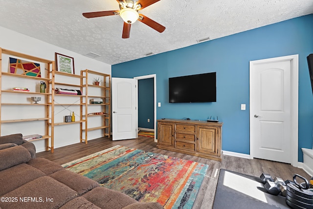 5327 Attleboro St, Jacksonville, FL 32205 - living area featuring wood finished floors, ceiling fan, a textured ceiling, and baseboards