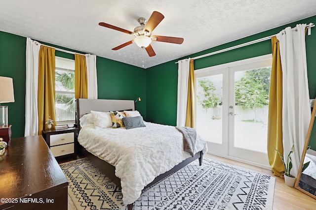 5327 Attleboro St, Jacksonville, FL 32205 - bedroom with access to outside, multiple windows, wood finished floors, a textured ceiling, and french doors