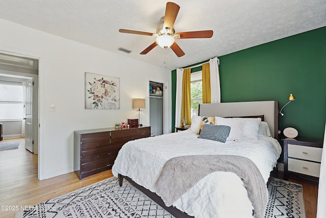5327 Attleboro St, Jacksonville, FL 32205 - bedroom featuring wood finished floors, baseboards, a ceiling fan, and a textured ceiling