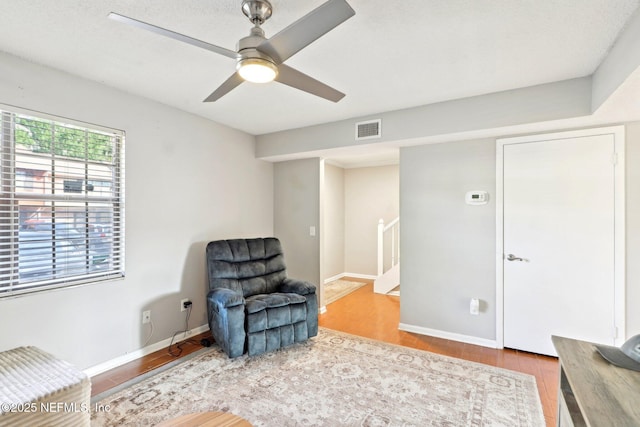 1101 Kettering Way, Orange Park, FL 32073 - sitting room featuring wood finished floors, a ceiling fan, and baseboards