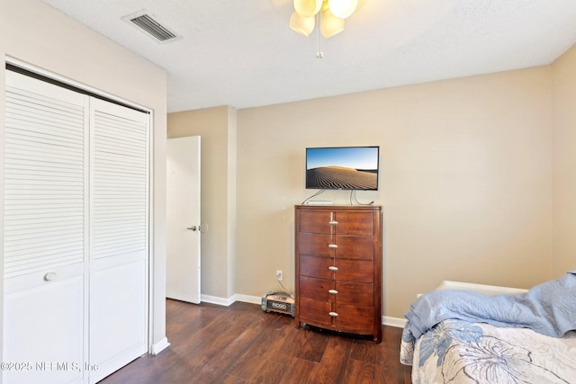 1101 Kettering Way, Orange Park, FL 32073 - bedroom with baseboards, dark wood-style flooring, a closet, and a ceiling fan