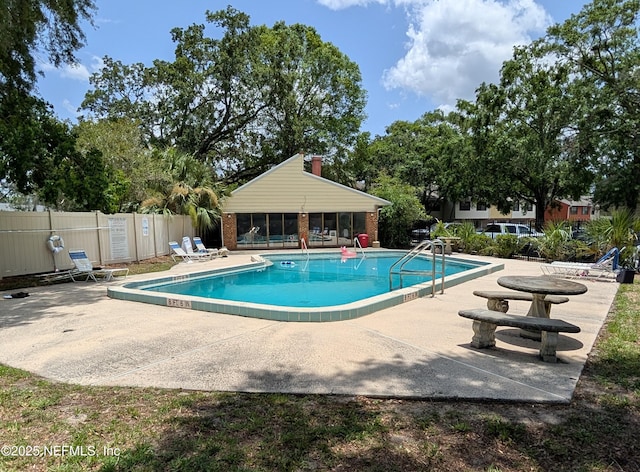 1101 Kettering Way, Orange Park, FL 32073 - community pool featuring a patio and a sunroom