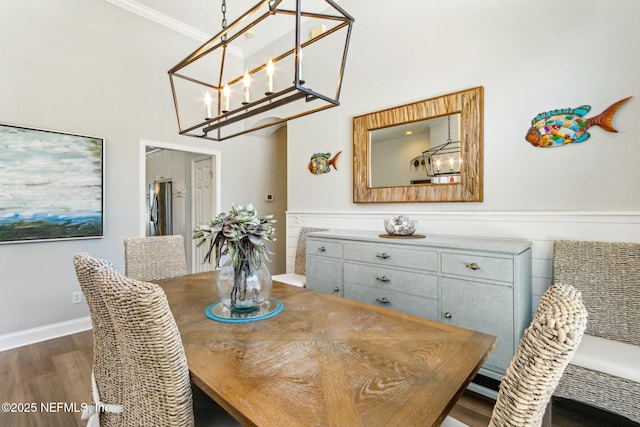 2738 Sea Grove Ln, Fernandina Beach, FL 32034 - dining space featuring dark wood-style floors, a chandelier, crown molding, and a high ceiling