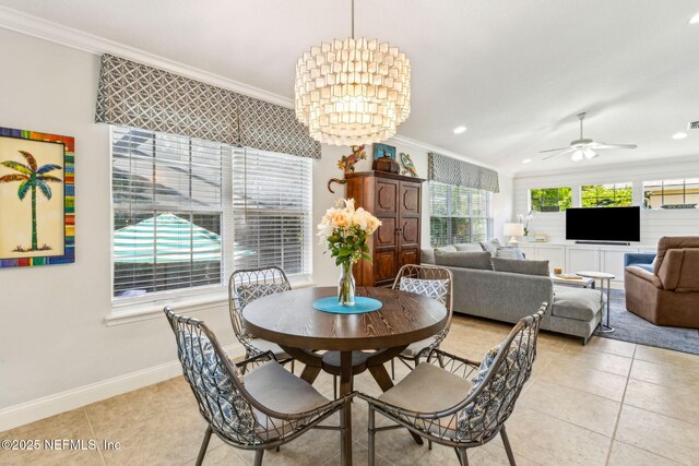 2738 Sea Grove Ln, Fernandina Beach, FL 32034 - dining space with ornamental molding, light tile patterned flooring, baseboards, ceiling fan, and a chandelier