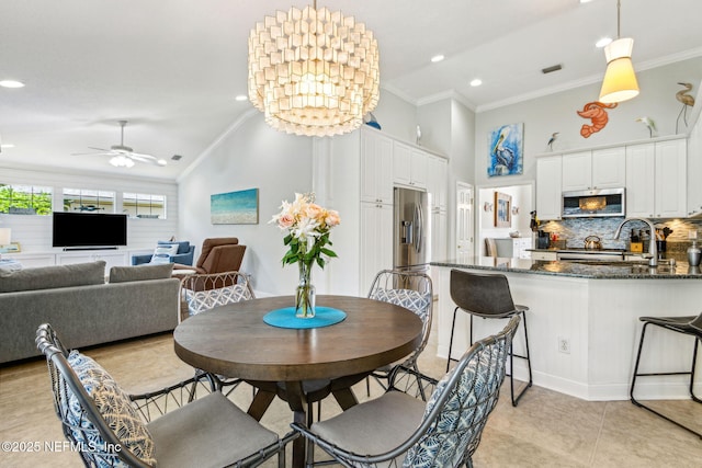 2738 Sea Grove Ln, Fernandina Beach, FL 32034 - dining space with ornamental molding, a ceiling fan, light tile patterned flooring, recessed lighting, and high vaulted ceiling
